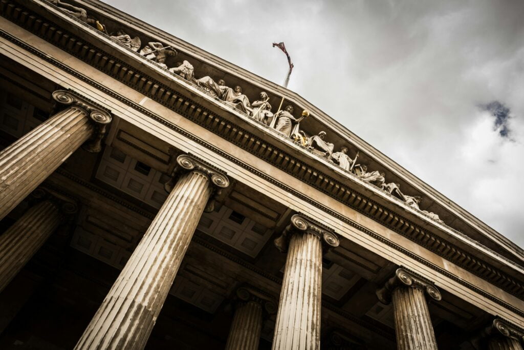 A close-up of a law court building with majestic columns.